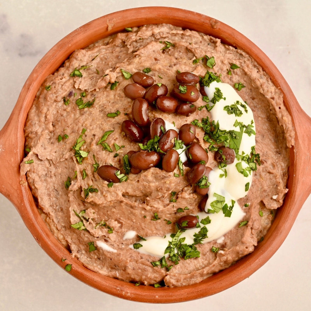 A bowl filled with creamy homemade black bean dip