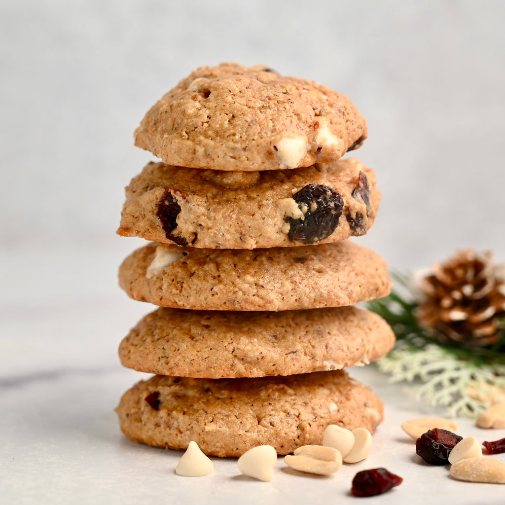 A stack of cranberry cookies with white chocolate chips