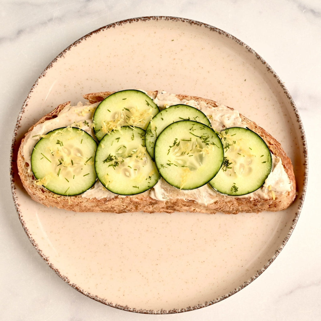 Slice of toast with slices of fresh cucumber on top