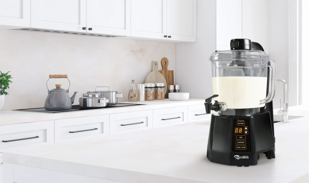 The Nutramilk processor sits on the counter in a white ultra modern kitchen