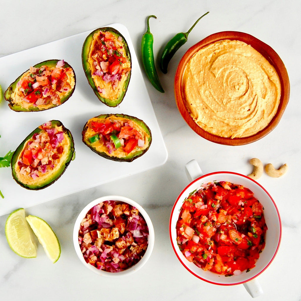 Baked and Stuffed Avocados With Cashew Queso and Sausage