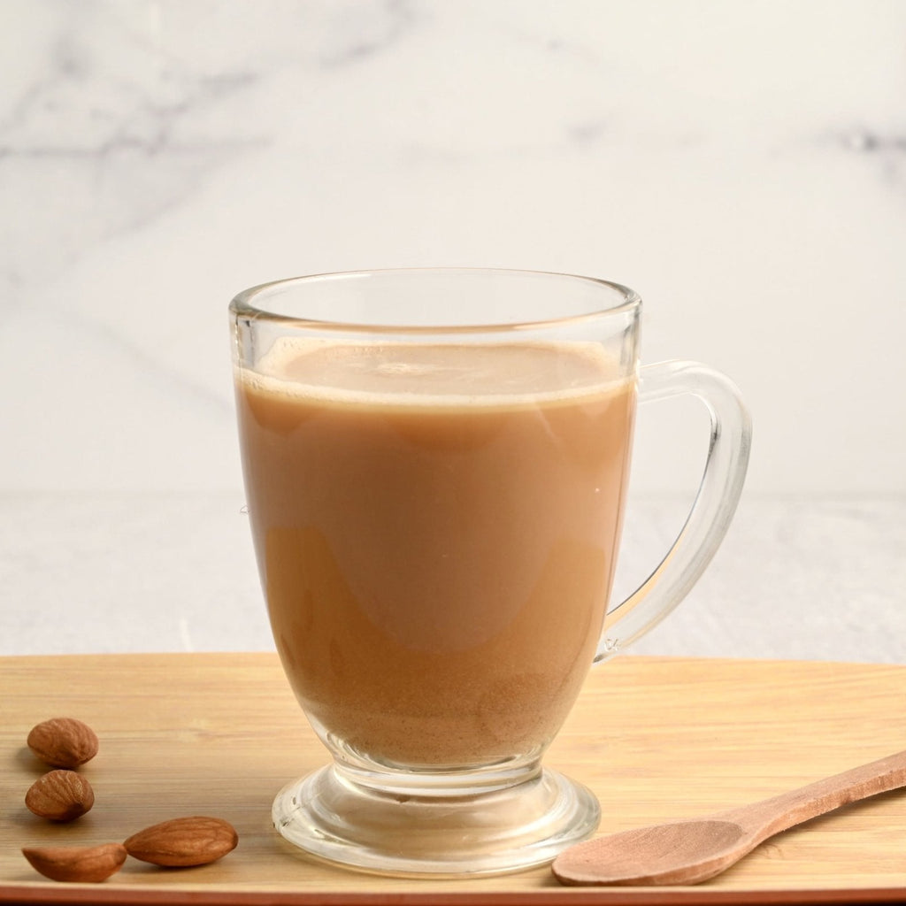 Clear coffee mug filled with almond butter keto coffee
