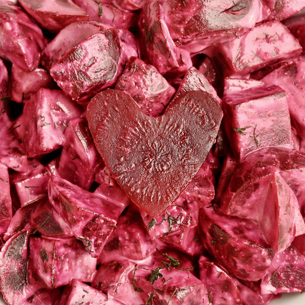 Diced beets with a beet in the shape of a heart at the center