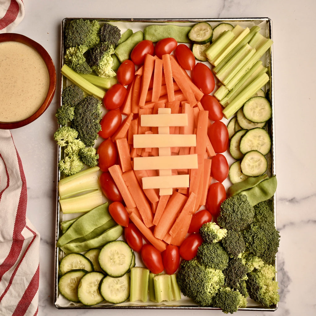 Overview of veggie tray in the shape of a giant football