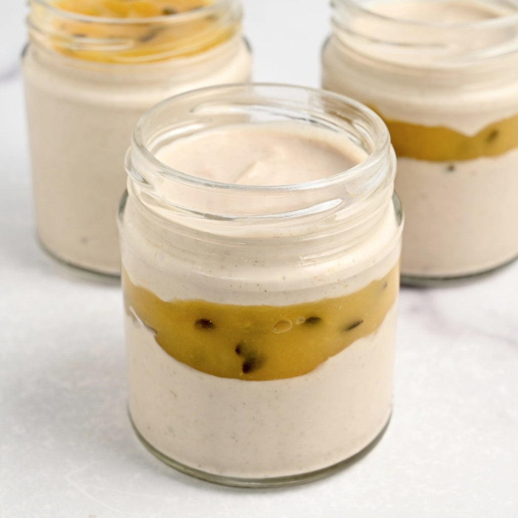 Three glass jars filled with creamy and white homemade yogurt