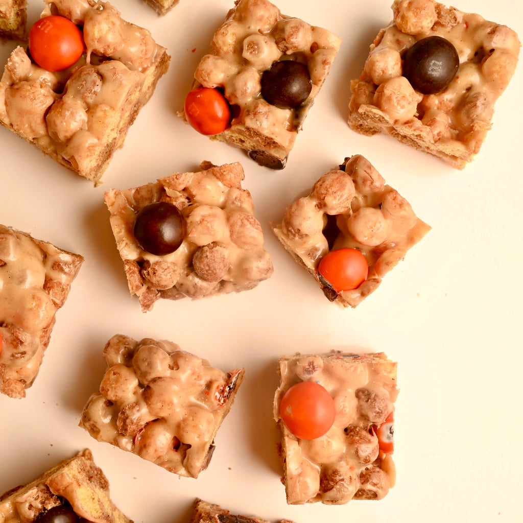 Peanut butter cereal bars with black and orange M and M candies