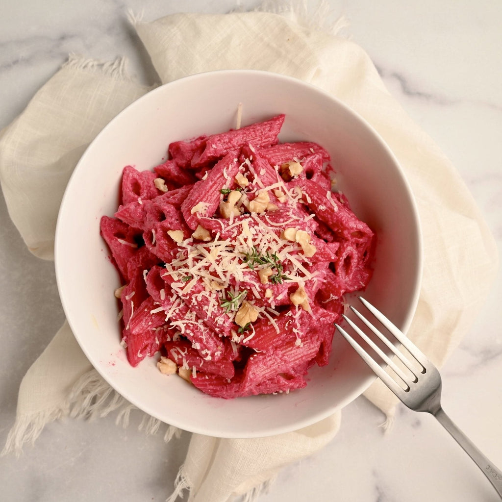 Penne pasta with pink creamy roasted beet sauce