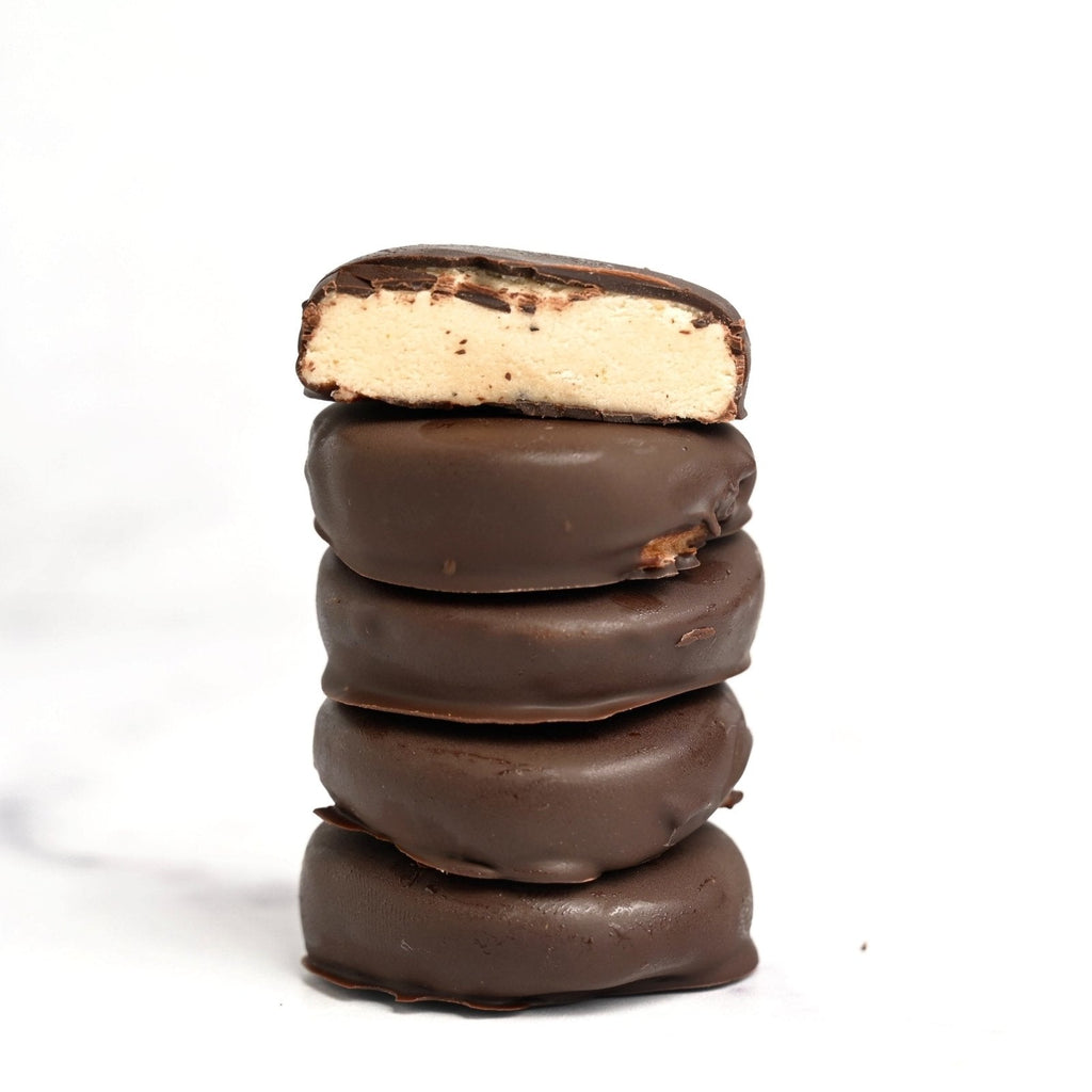 A vertical stack of chocolate dipped peppermint patties