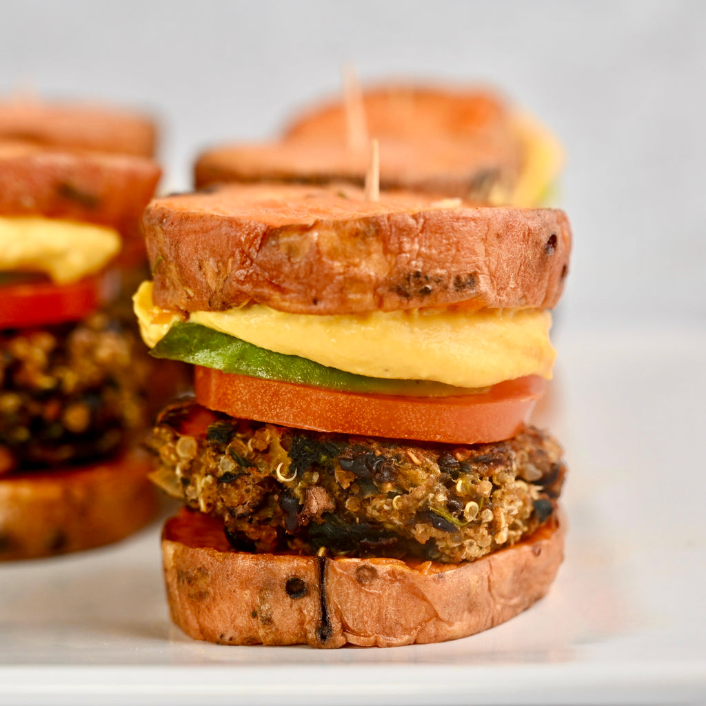 Plant based burgers between two sweet potato slices