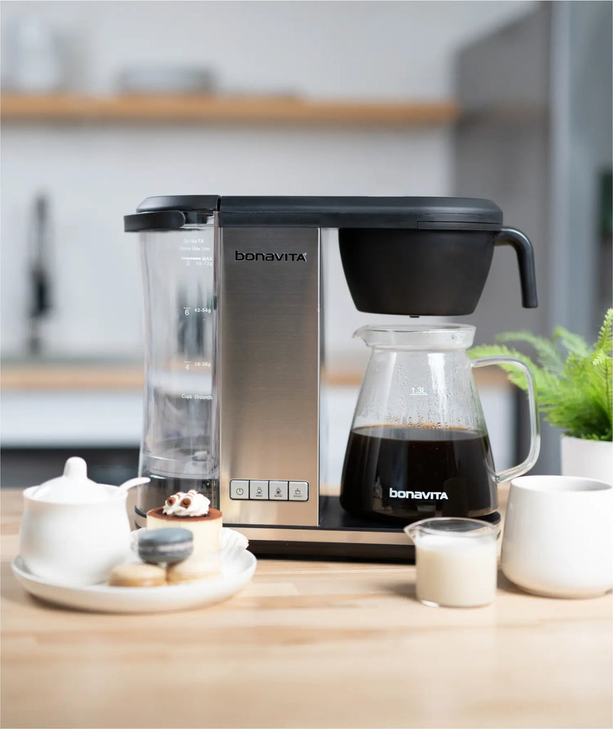 Bonavita Enthusiast glass coffee maker on a wooden counter in a modern kitchen