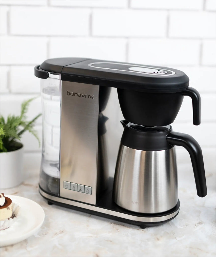 Bonavita Enthusiast thermal coffee maker on a marble counter in a bright modern kitchen