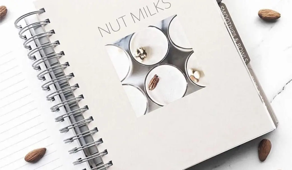 The Nutramilk recipe book on a kitchen counter.