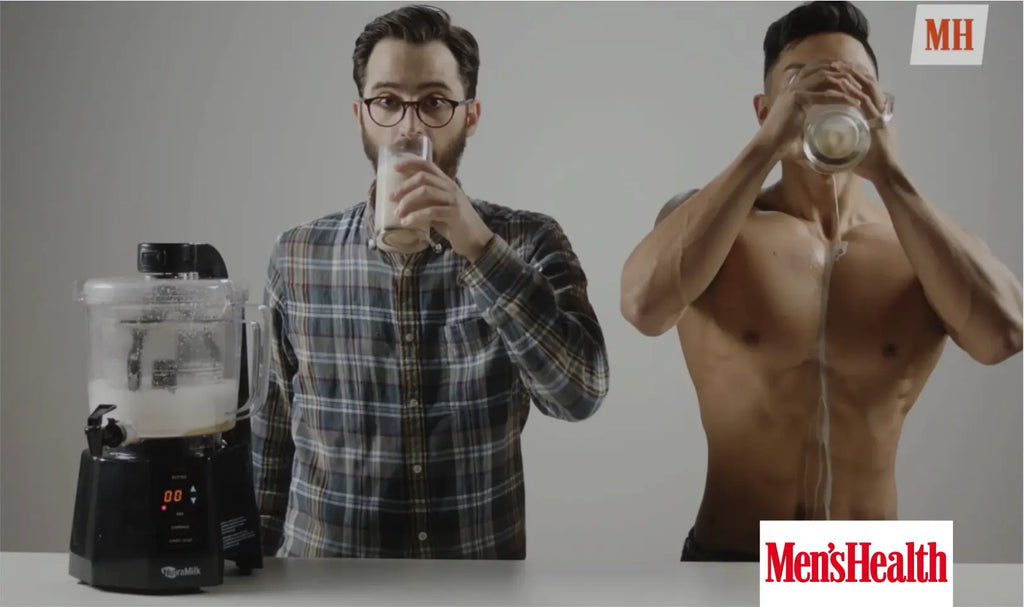 Two men making nut milk with the Nutramilk processor featured in Men's Health Magazine.